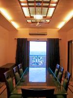 the dining room opens onto a balcony overlooking the sea from the 15th floor.